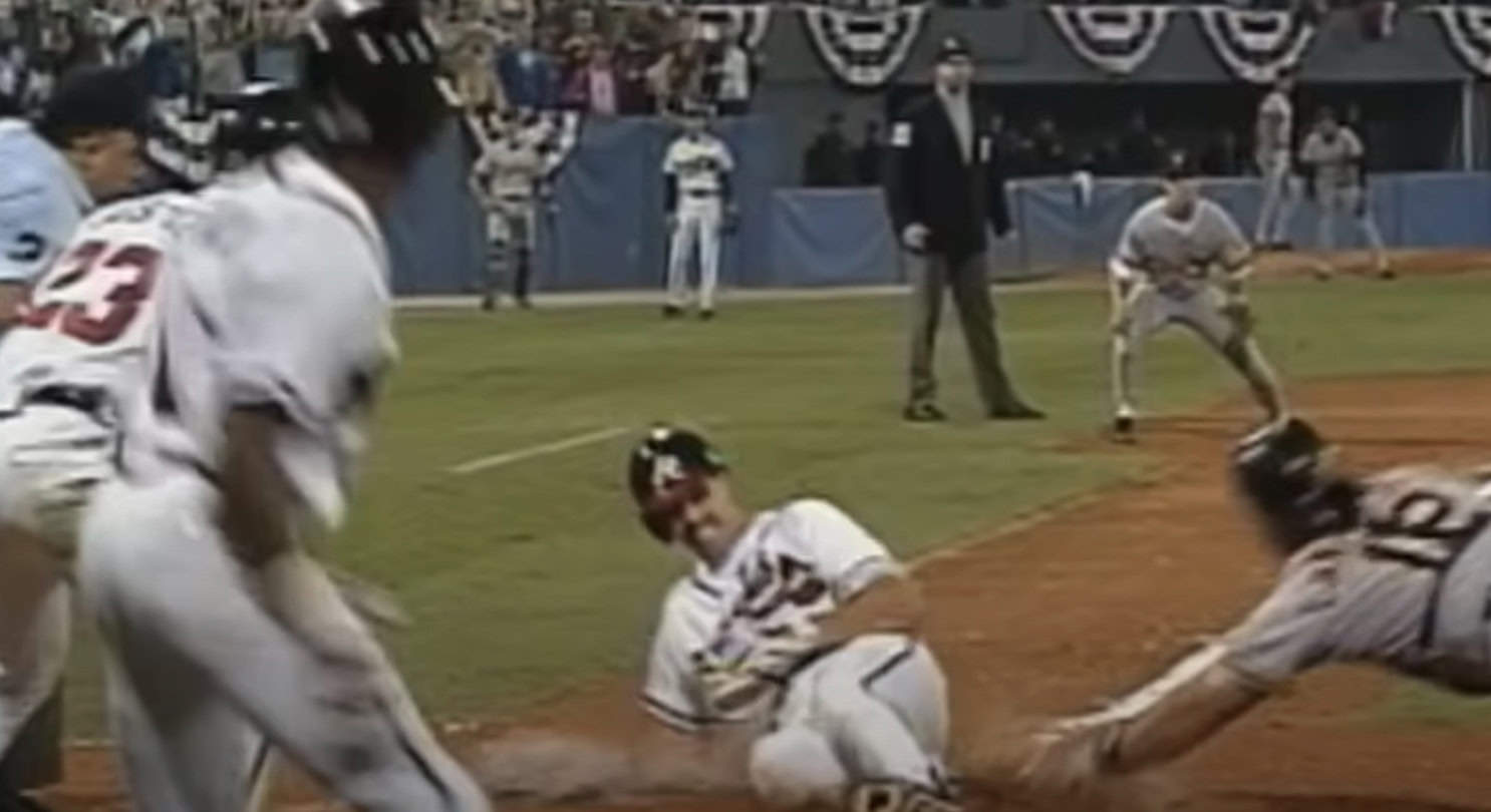 Iconic moment of Sid Bream sliding home, clinching the 1992 NLCS for the Braves.